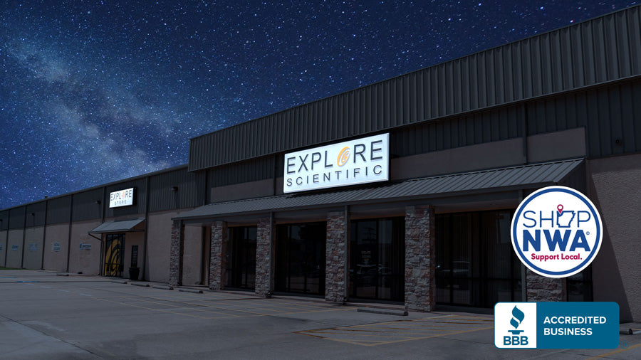 Explore Scientific Headquarters at night, under a starry sky. Featuring Shop NWA, Support Local icon and BBB Accredited Business icon